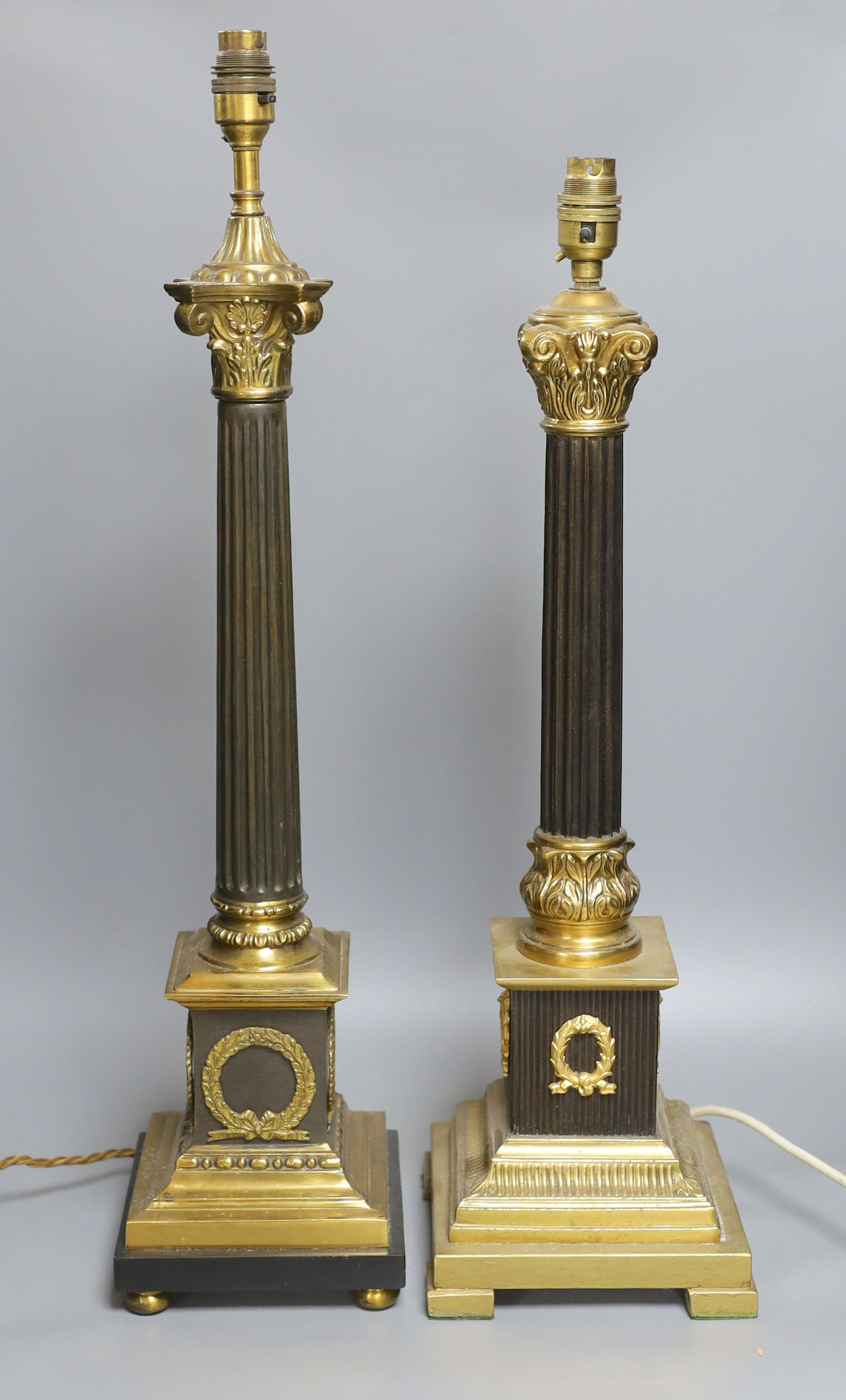 Two composite column table lamps - tallest 66cm